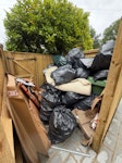 Rubbish (bin bags/cardboard) Rubbish - a lot of black bin bags and cardboard, plus the contents of 2 or 3 residential rubbish bins. GU24 - removed for £357