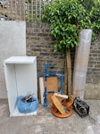 Bits and bobs see photo perspex, white MDF, large unused cardboard tube with endcaps, hanging bar, compressor few old pieces of wood and small cork notice board NW3 - removed for £84
