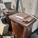 Garden & Home Waste Wheely Bins x2 (note that bins are full of mixed garden waste), Wheelbarrow & soil in wheelbarrow, soil in black bags, radiator, chair, concrete tiles. Quick access through side gate. SS7 - removed for £156