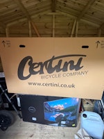 Cardboard boxes and a suitcase collected by Riff Raff Rubbish