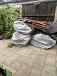 Garden waste - wood & metal 3 large bags full of wood planters broken down, metal swing set and some plastic items TW20 - removed for £393