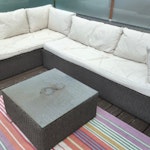 Rattan Corner Sofa & Table Two rattan sofas with cushions. Each measures 200CM x 90CM; 90CM deep. Also square rattan table (70CM x 70CM) with glass top. Will only consider quotes including removal from top floor deck to street (stairs). NW2 - removed for £130