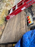 Misc building rubbish and gate A pallet, a chip board, a metal gate, misc broken bits and pieces and some wood planks. NW6 - removed for £104