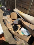 a dozen bags and a few boxes. mostly rubbish from a recent move. discarded items, packing paper, boxes, medium rug. also have a rocking chair in good condition if you want it KT12 - removed for £104