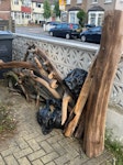 Clearance of tree/grass bits 4 bags of garden grass cuttings and tree branches and cut of bits of a tree, sitting in the front garden of property CR7 - removed for £71