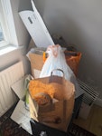 household junk mostly cardboard, and household junk such as one old hob, one stool, one small suitcase and a circular small table with 4 chairs. SW16 - removed for £195