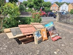 Demolished wooden shed Demolished wooden shed (9 pieces plus roofing felt & bag of loose wood), 2 bags old tiles, roll of old bamboo fencing, 2 long metal cabinet sides & 1 shelf, old metal gutter & rotten deck board KT1 - removed for £156