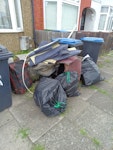 General Waste 3 black bags
carpet tiles
old suitcase
office chair
old curtain rail N9 - removed for £130