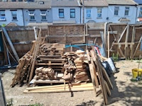 Pile of timber collected by Universal N&D LTD
