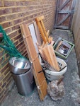 Broken household items Broken household items (fan, bin, rotary airer, storage crate, plastic plant pots etc.), some wooden parts of a bed, some glass, lump of concrete from garden. BN14 - removed for £83