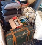 Household Waste I have a large plastic storage drawer, a mat, folded commode in a box, a memory foam mattress, old folding chairs x2, a computer base, small and large portable radiators, a medium suitcase, cushions x5, quilts x2, racks x3, garden scissors x2, a food mixer, a box with bits and bobs and a trampoline RM6 - removed for £257