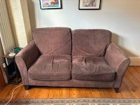Two two-seater sofas collected by Pat Smith Environmental Ltd