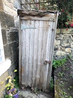Old wooden garden shed collected by Moving Force