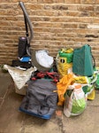 Misc items from house + garden 1 x working mower (good condition),
1 x broken vacuum,
2 x cutting boards (good condition),
1 x cooler bag (good condition),
1 x cat basket (good condition),
1 x yoga mat (good condition),
5 x bags old lawn seed (heavy) 
2 x bag rubbish,
1 x old shoes (good condition) N1 - removed for £99