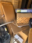 cardboard boxes, car seat,wood cardboard boxes, car seat, plastic slide, wooden tables in the original packaging itself as it was damaged..small wooden bay chair RG23 - removed for £175