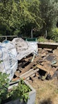 Timber, metal fence panel Assortment of old timer, metal panel, plastic crates. We are a group of volunteers managing a community garden in a park but the council can’t collect the rubbish SW12 - removed for £214