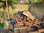 shed and garden waste Demolished 3meter by 2.5meter shed. Assorted garden trimmings. PO8 - removed for £257
