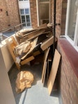Balcony full of moving rubbis We have a balcony full of rubbish - mostly around 40 cardboard boxes that have been broken down, a few bags of rubbish but the biggest thing is one large piece of wood - about 3m tall, 60cm across and 10cm deep. I need someone to come up to the first floor and take all the rubbish down, I won’t be able to leave it outside for you. There is a small lift. SE5 - removed for £82
