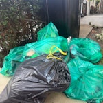 10 bags of rubbish 10 bags in front garden W11 - removed for £71