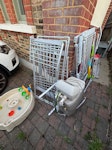 Mix of toys and old electrical Some old broken clothes racks, an old water softener, a kids garden play kitchen, some pots, an old blind, a long piece of glass from coffee table. SE9 - removed for £71