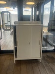 Office furniture White storage cabinet, printer, rhino statue and a large coat rack with storage at the base. NW1 - removed for £104
