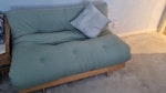 A futon sofa bed This futon bed has fire labels and it is very comfortable and in good condition other than the slat in the photograph which is always covered when in use as either a sofa or a bed.  The mattress has pocket springs which makes it comfortable although quite heavy.  There are no stains. I am only getting rid of this because I have a new sofa bed. N1 - removed for £110