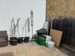 Few rubbish bag & photo items 2 ikea wardrobe, chair, shoes case, 4 plants, barbecue rack, patio umbrella with stand, dismantled storage shed, plastic box, garden furniture (a 2-seater & 2 round seat), misc items and a few rubbish bags. NW2 - removed for £286