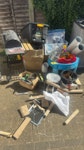 branches, cardboard and boiler garden branches, cardboard boxes, boiler part and general waste. TW20 - removed for £357