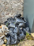 General Waste,Rubble, Garden, 25 bags of granite rubble left over from woodburner installation plus some loose in a pile. Further 20 bags of old gravel. A corroded metal large plant pot, broken garden chair. Pile of bush branches and leaves. 2 x pallets. Broken up bed frame and shelving unit. Double mattress. 
Easy access via back gate to lane which is clear to park while load. AB25 - removed for £280