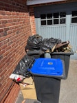 some household rubbish bags with rubbish, some old cans. everything except for the bins. GU24 - removed for £94