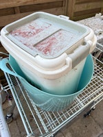 Box of fermenting bird seed collected by Clear Away Junk