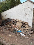 4drs, shed panels, gdn waste Various pieces of fencing/wood, shed panels, 4 light doors, pile of garden cuttings GU16 - removed for £550