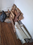 8m2 linoleum and oard sub-base 8m2 linoleum removed with chipboard sub-base and nails
Chimney concrete hearth removed + 1 bag of rubbles
A couple of pieces of old floorboard SE23 - removed for £83