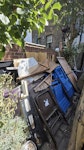 Large mix of garden/home waste The pile of junk is mainly slats of wood from fencing and broken down sheds. The rest is miscellaneous junk (folding chairs, bucket, etc). Parking restrictions except for Sundays but I could contact council to see if I can get an exemption. The garden is on the ground floor but there is 5 steps leading into the house and 9 down to garden SW6 - removed for £407