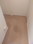 Water damaged hallway carpet. Carpet needs uplifting and removing, along with thick underlay, securing wooden batons and tacks. Carpet is l- shaped, approximately 2.5 metres at widest point 3.5 metres long. SG15 - removed for £280
