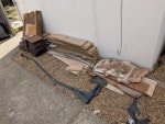 Laminate boards, palettes, etc Stack of laminate flooring and some underlay. Stack of plastic patio tiles. 3-4 old palettes. Rolled up rugs, curtain poles, pieces of tarp. 

It's currently in the back garden, but we will stack in front of the house for collection. SE6 - removed for £104