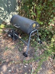 Bbq and household waste Bbq on wheels
Six planks of wood
Bits of Vinyl flooring 
Small bicycle pot holder
Metal end covers for cabinet delivery
A few Small Bits of hardboard 
Rucksack with chisels
Old canvas 
Extra large laundry bag with bric a brac
A lot may be reusable 

Not all items are photographed TW9 - removed for £130