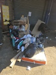 8 bags of mixed light rubbish Mixed rubbish damped in front of out building ,its 2 single matrasses ,1 double matrass  ,wooden cupboards and clothes . N22 - removed for £314
