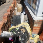Rubbish including radiator Rubbish in small front area between wall and front of house. Includes a radiator. GU1 - removed for £141