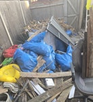 Garden waste mainly The main is 2 tonne size bags full of dead palm leaves. The majority of this is garden waste with odd bits like the office chair, plastic storage box. Please could I have a quote for this and i also have around 30 black bags of rubbish as well (son moved out and left mainly takeaway rubbish here, not pictured) KT6 - removed for £429