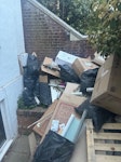 Bags and house Reno waste Hi, looking for a quote to clear the waste in the attached photos from SE10.

It’s mixed renovation waste including bags, cardboard, timber/pallets and bathroom/building offcuts. Everything is already outside in the front garden, with 3 steps to the pavement and a short carry to the road.

Could you give me a fixed all-in price including loading and disposal? Please also confirm you’re a licensed waste carrier.

Thanks. SE10 - removed for £343
