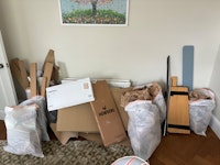 Cardboard & broken bookshelf collected by M&V waste Clearance