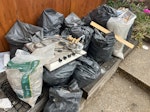 rubble bags, rads, doors rubble bags, timber, glass, doors, radiators 8, bathroom sink and vanity E5 - removed for £176
