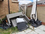 Garden furniture and rubbish Rattan sofa large parasol a bike a sun chair and just some other bits of rubbish in black bags DA12 - removed for £165