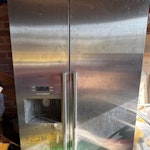 American style fridge freezer Height 180cm, width 90cm, depth 70cm. Currently in garage which opens directly onto driveway. RG27 - removed for £174
