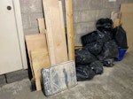 Bathroom renovation waste Bathroom refurbishment waste from two bathrooms. Mainly broken ceramic tiles, tile adhesive/grout, plywood and timber offcuts, damaged wooden flooring/subfloor, and bagged general building debris. No hazardous waste. EC3N - removed for £104