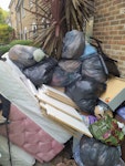Household waste & furniture Household waste from moving out. Includes mattress, black bags of household waste, dismantled furniture/wood, shelving, chair, scooter. Everything shown in the photos needs to be removed. All items are already outside at the front with easy access. E9 - removed for £260
