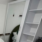 wardrobe/loveseat/desk/bed i have: a mirrored sliding door doublewardrobe; double bed with matress; long oak storage unit; loveseat sofa; small metal round table with 2 chairs; office desk; marble coffee table. BN2 - removed for £182