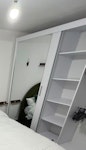 wardrobe/loveseat/desk/bed i have: a mirrored sliding door doublewardrobe; double bed with matress; long oak storage unit; loveseat sofa; small metal round table with 2 chairs; office desk; marble coffee table. BN2 - removed for £182