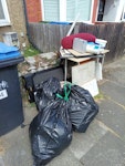 general waste 3 black bags
1 walking pad
2 pots of emulsion 
1 old desk
5 old bits of wood
1 cushion 
4 pictures N9 - removed for £88